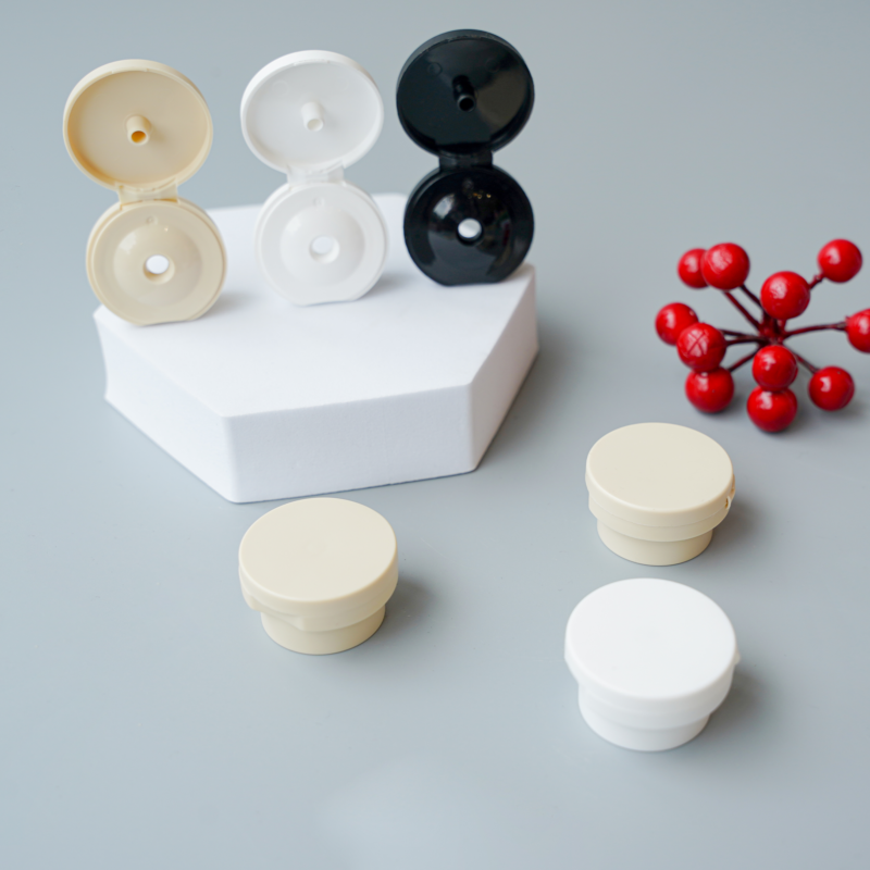 Flip-top plastic caps with 24/410 and 28/410 neck sizes for cosmetic bottles.